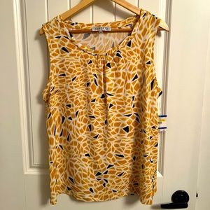 Yellow and black print blouses by Kasper.